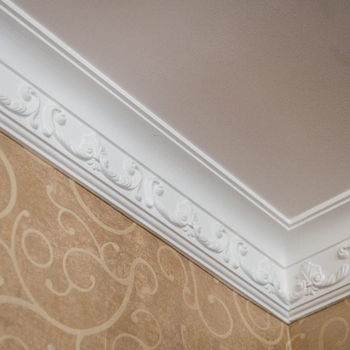 Luxury Home ceiling corner ornamental moulding detail.